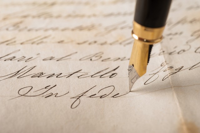 Fountain pen writing on an old handwritten letter
